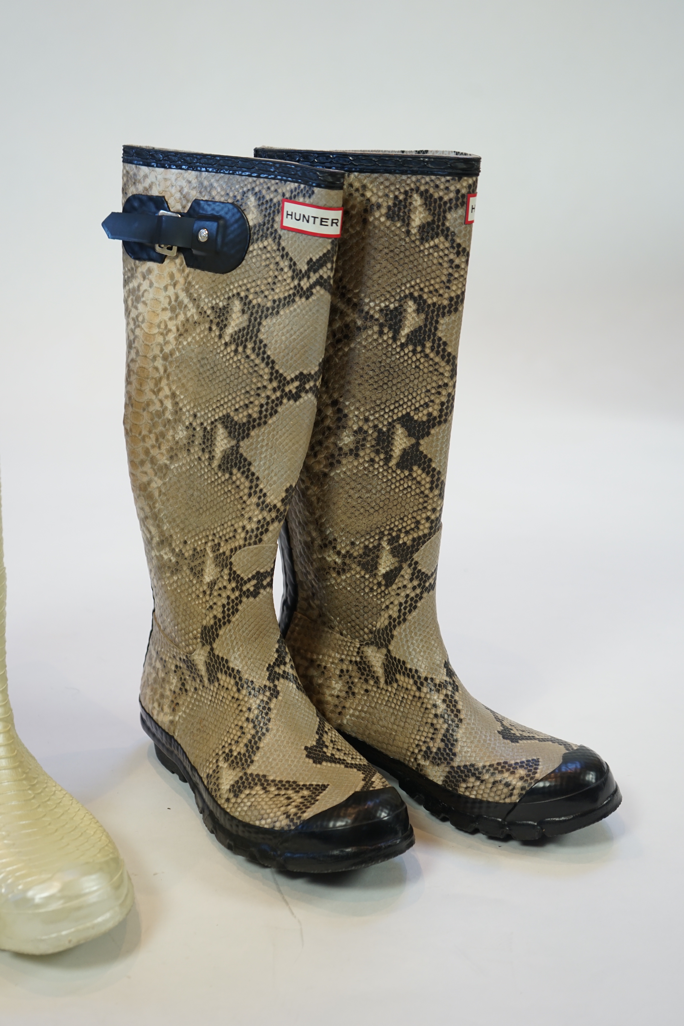 Two pairs of lady's Hunter snake-skin effect wellington boots, size UK 7